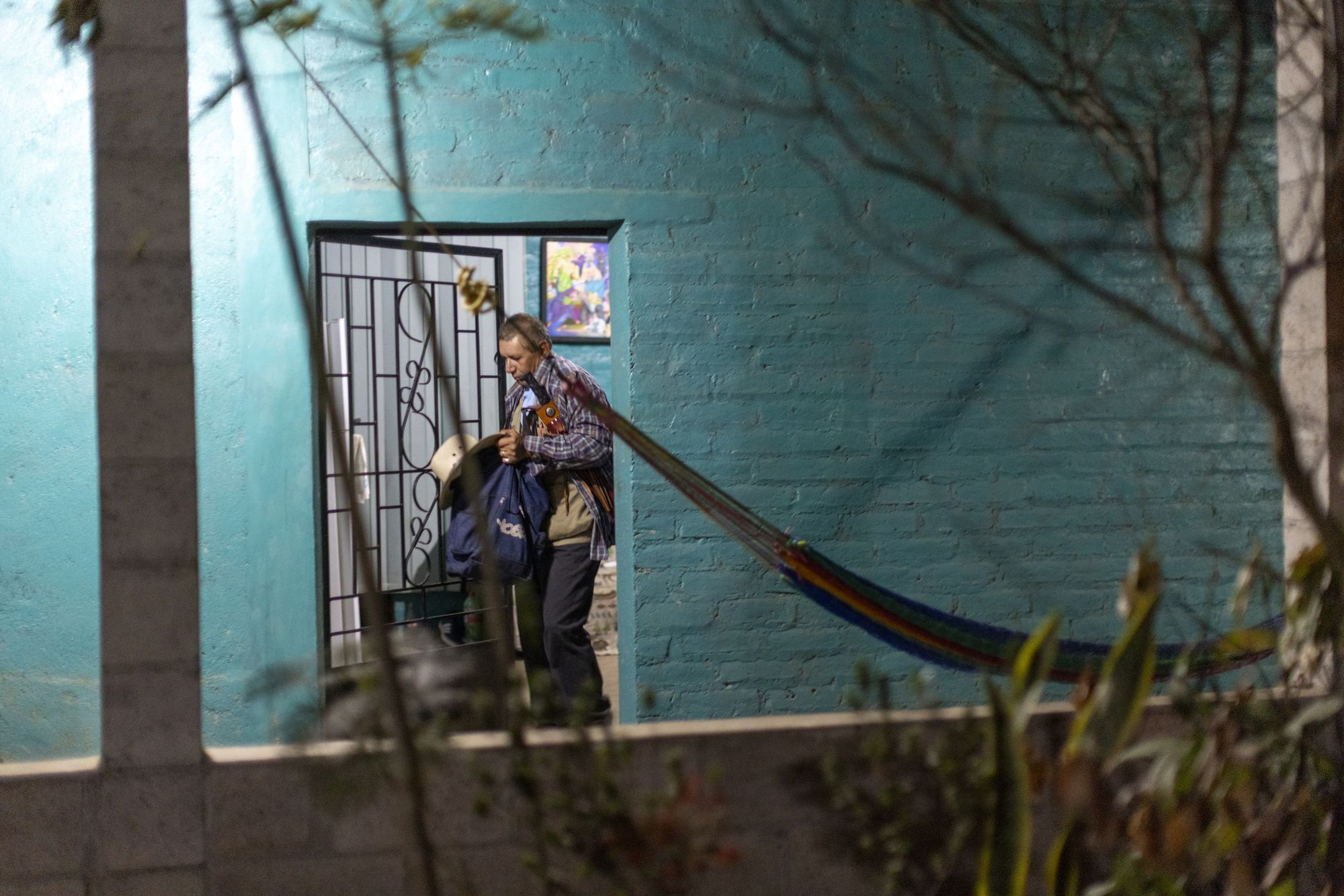 Santos Cano, sugar cane work captain, with his cane cutters on a bus to work in Guazapa, El Salvador on March 7, 2026.