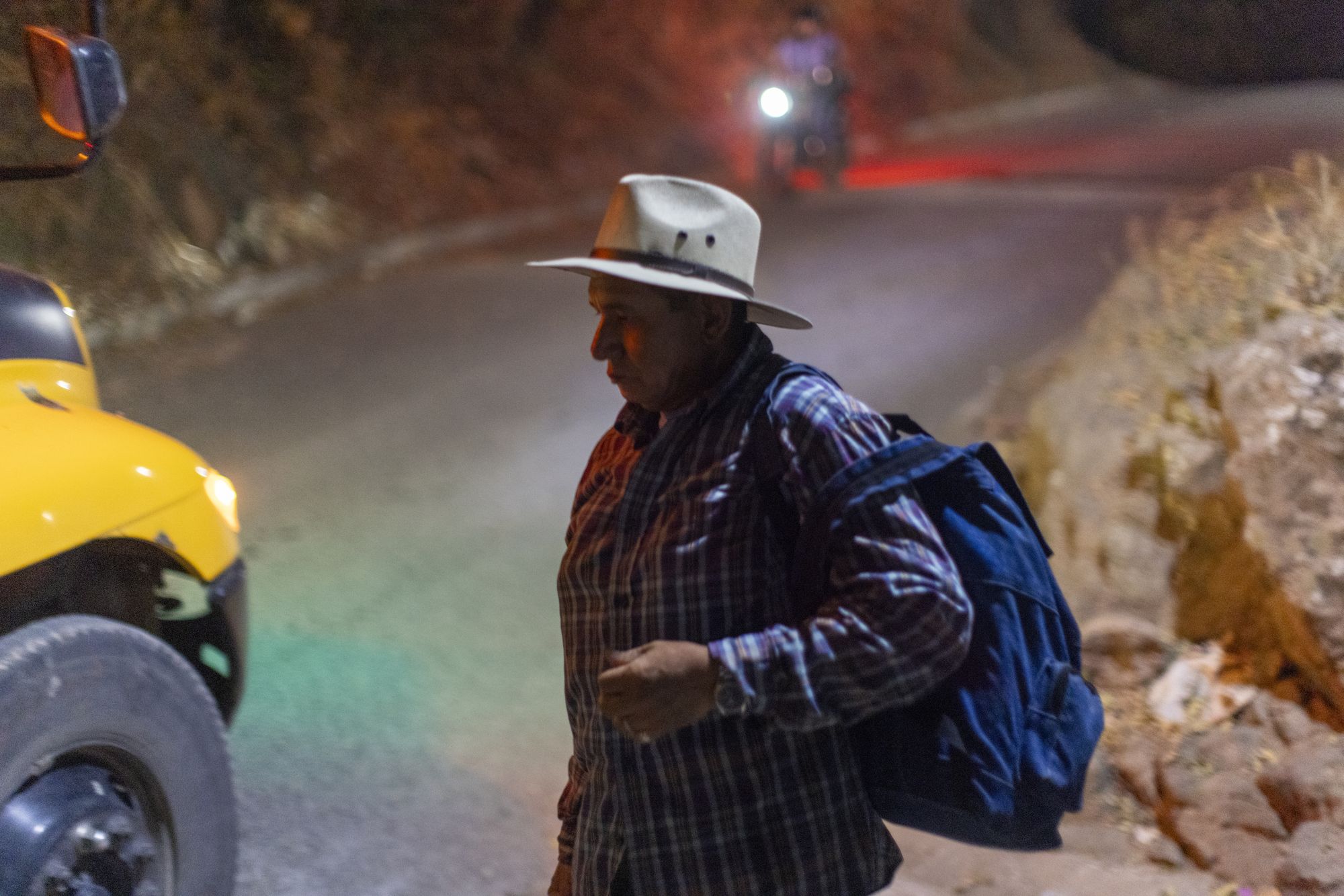 Santos Cano, sugar cane work captain, with his cane cutters on a bus to work in Guazapa, El Salvador on March 7, 2026.