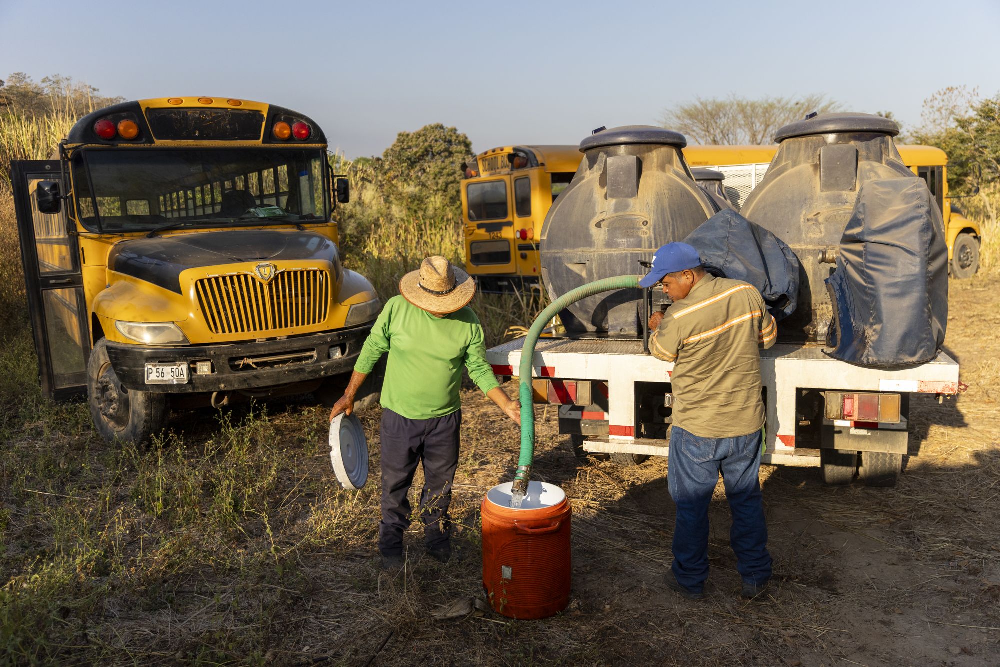 Sugar cane workers participating in La Isla Network's PREP program, which incorporates rest, water and shade into their work routine,  in Guazapa, El Salvador on March 7, 2026.